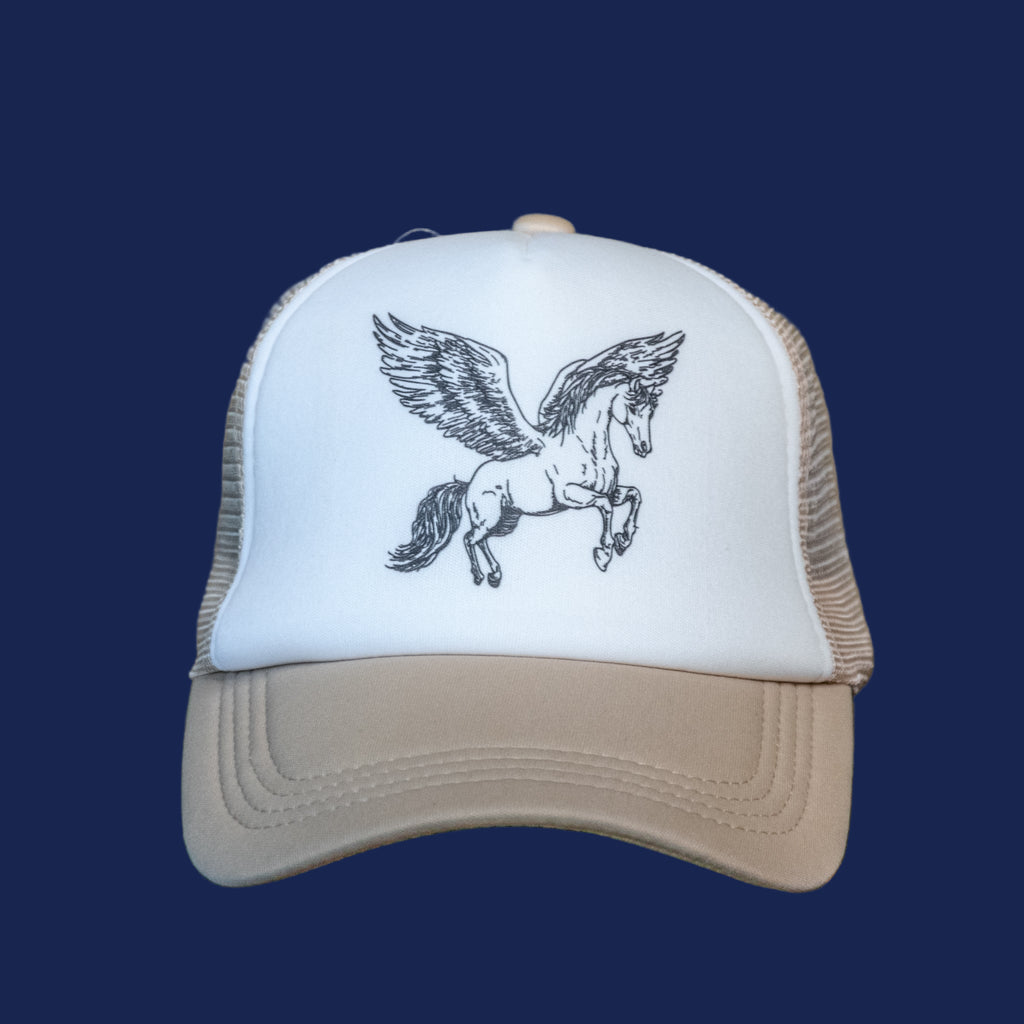 White cap with a black horse design on a wooden surface